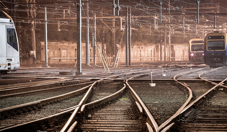 cross roads of rail tracks and trains