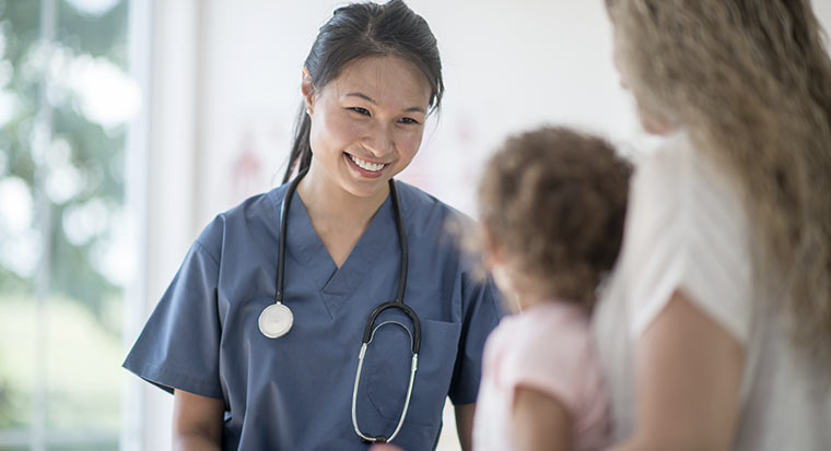 doctor with stethoscope and child