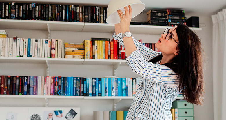 Woman performing home maintenance