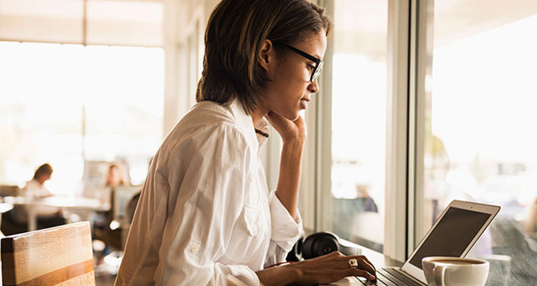 Woman in cafe on laptop