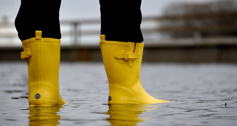 Yellow gumboots in flood