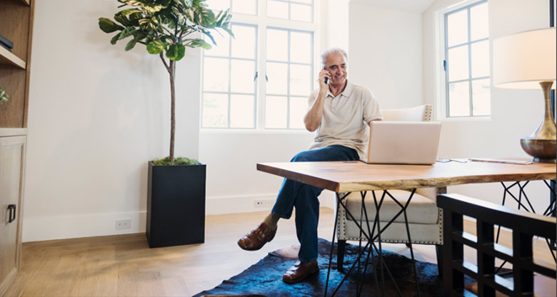 Man in home office on laptop