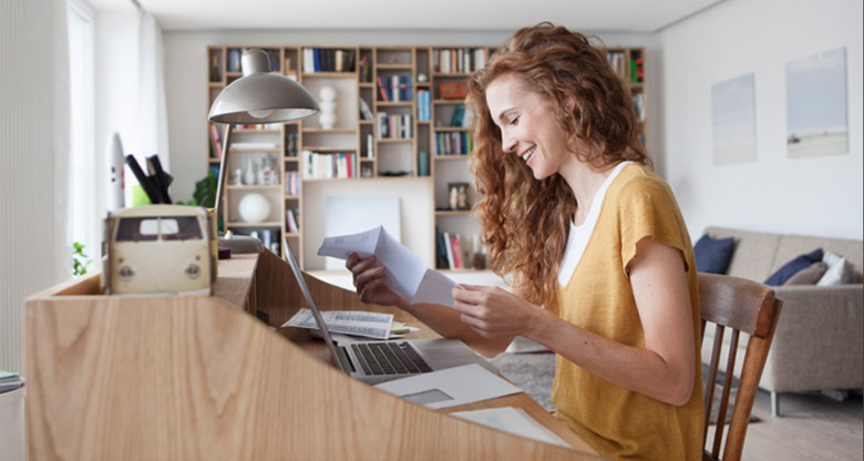 Young woman at home desk