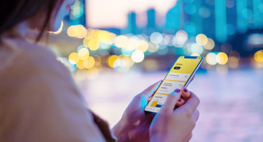 Woman using the CommBank app on her phone