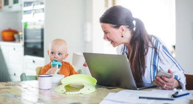 Young mother at home with her baby