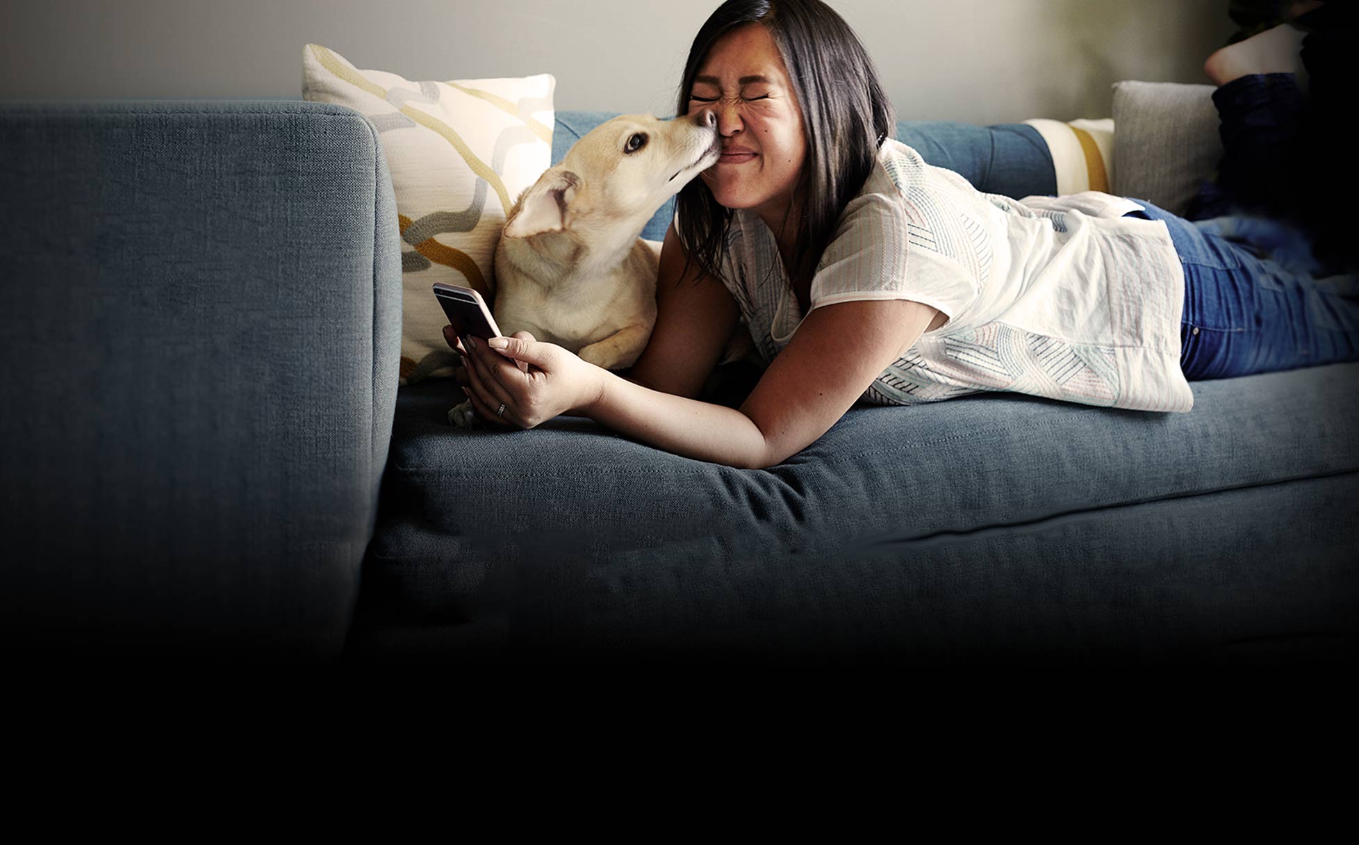 Girl with mobile phone and her precious dog