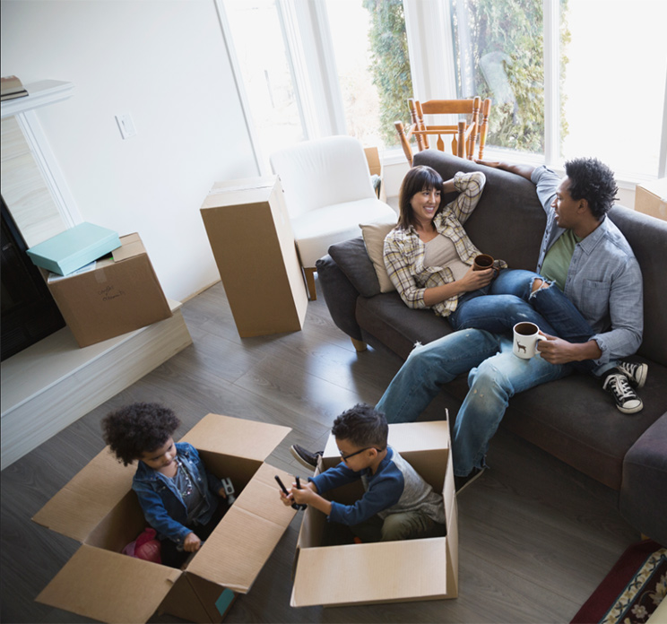 family relaxing after packing up their home