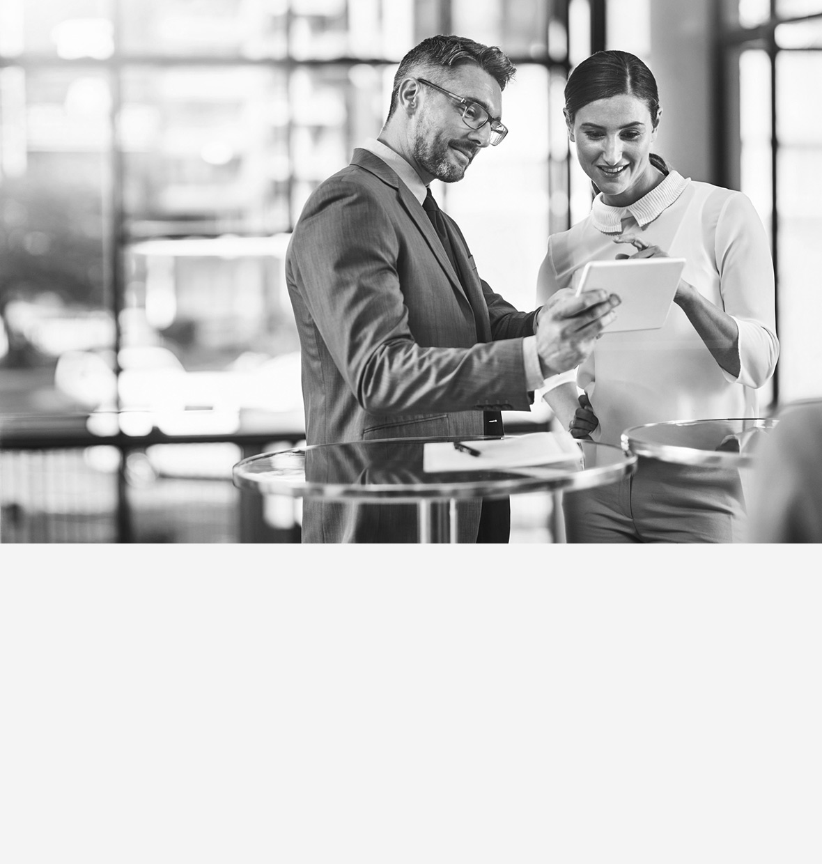 Man and woman looking at a tablet