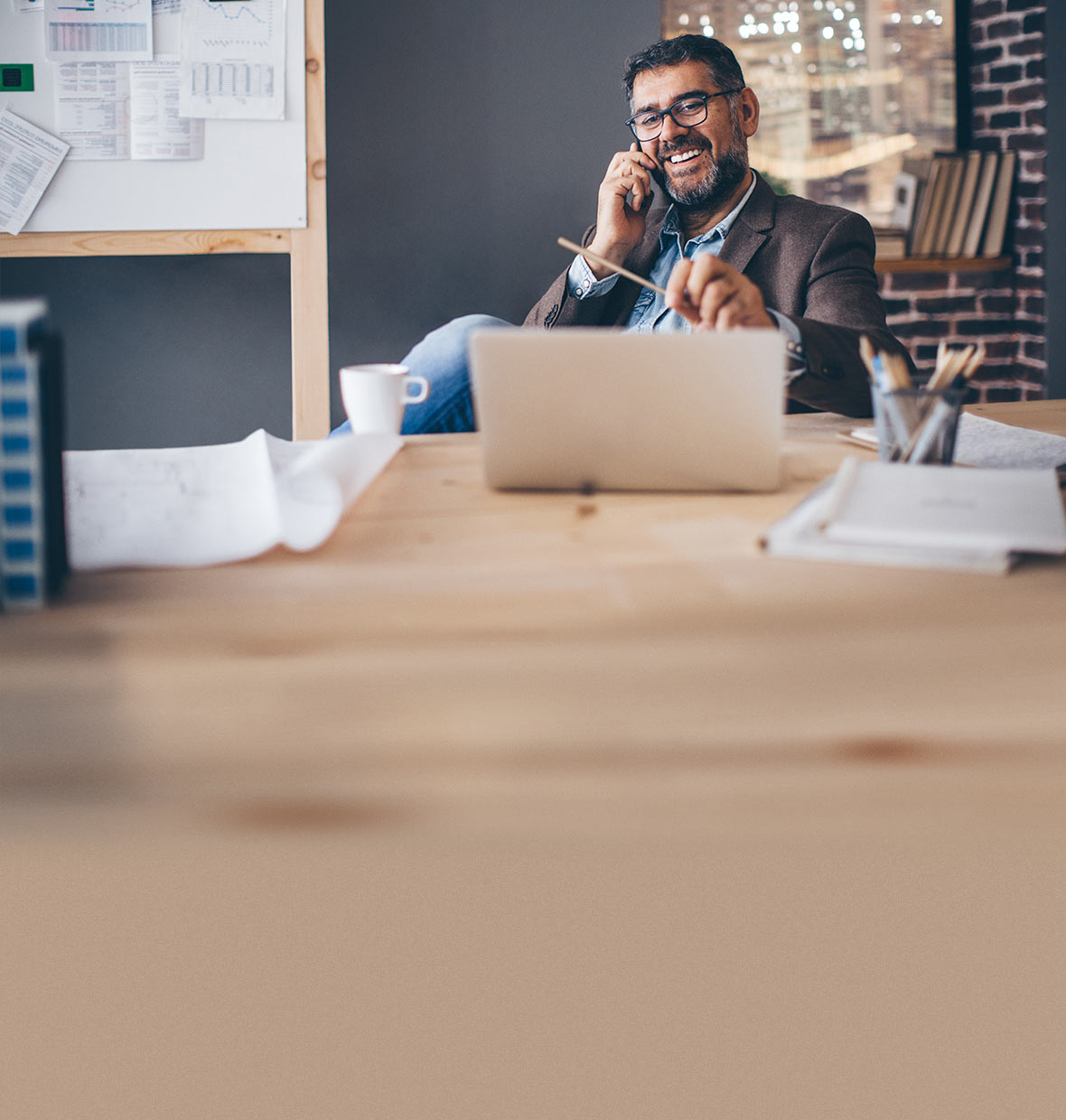 Man sitting at a table on laptop