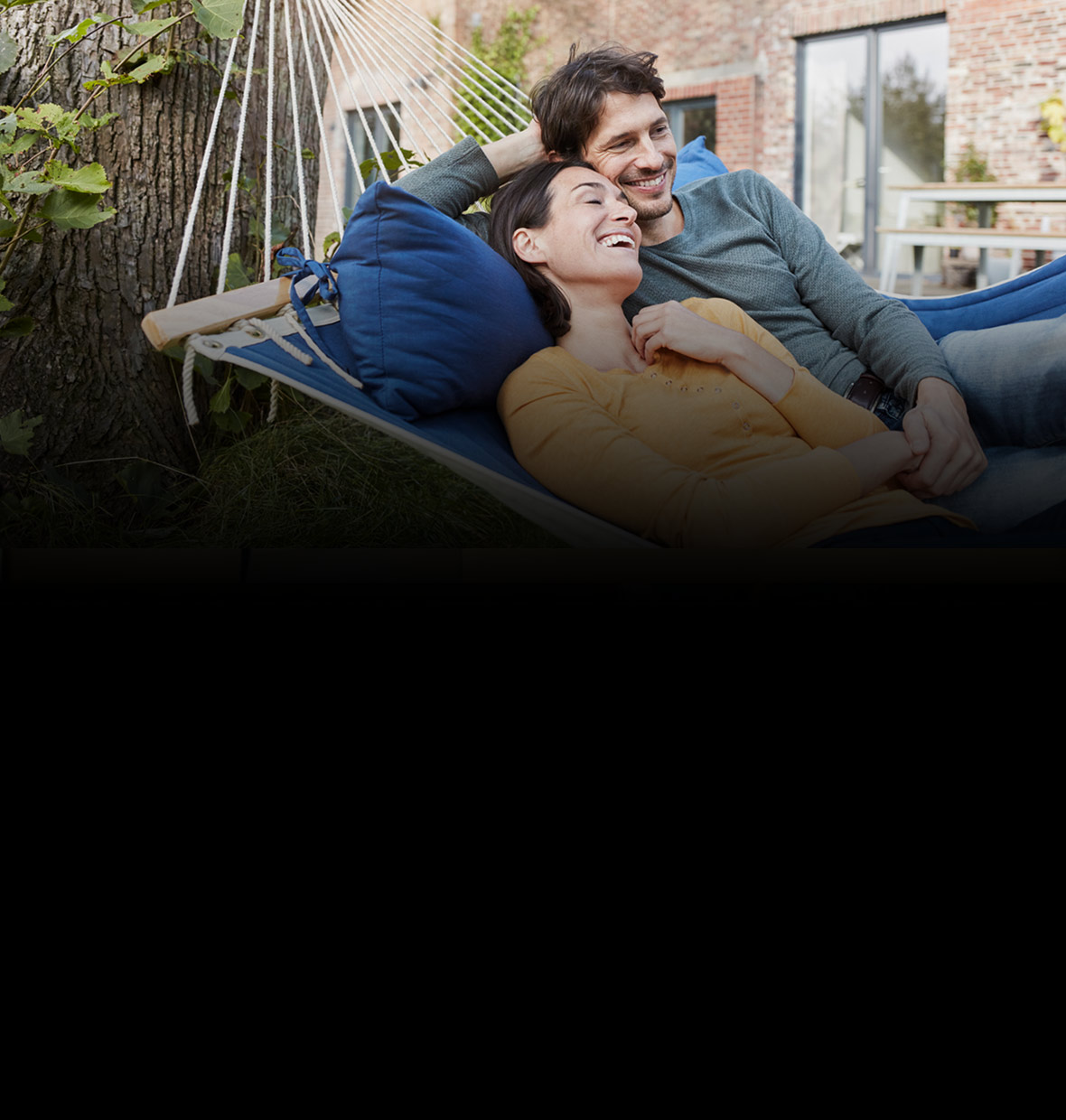 A couple relaxing in a hammock