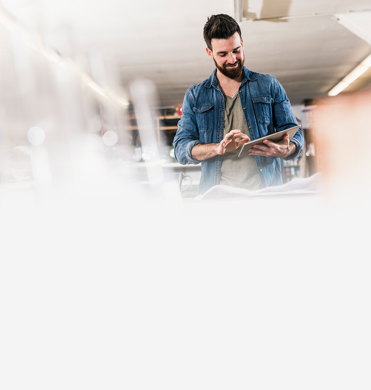 Man looking at his tablet