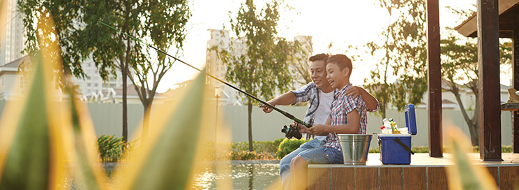 Father and son fishing together