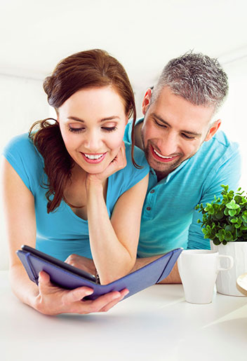Man and woman looking at tablet