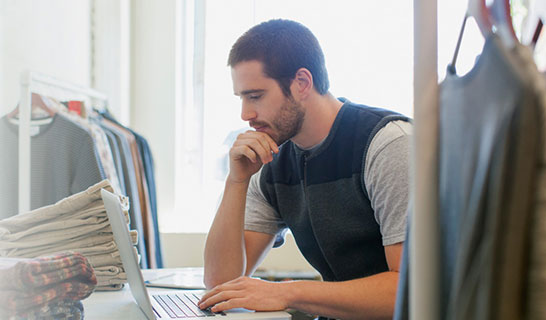 A man looking at laptop