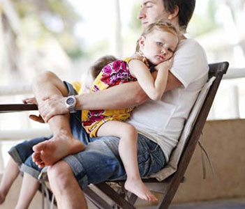 man and child on chair