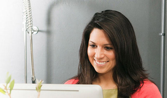 Woman looking at a computer