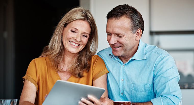 Couple looking at tablet