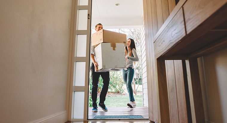 Image of couple moving into new home