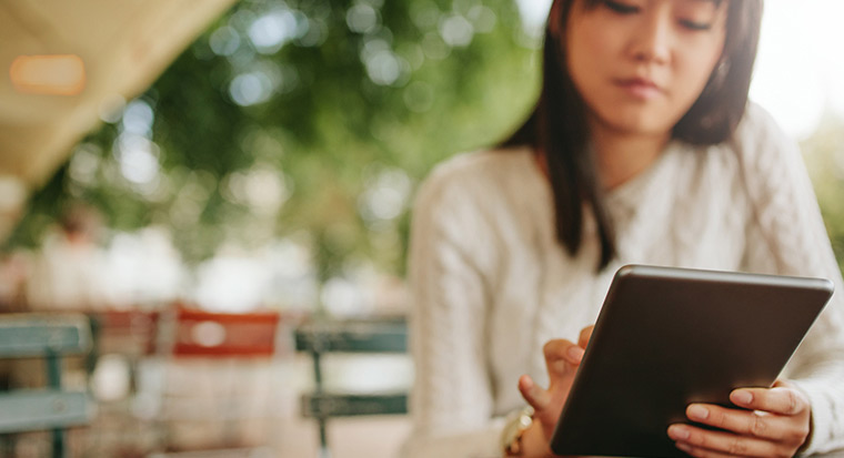 Young woman working on her ipad