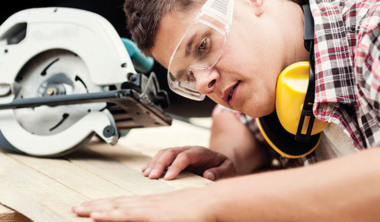 Tradie in safety goggles