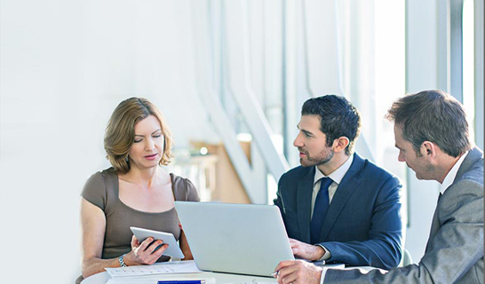 Lawyers looking at tablet
