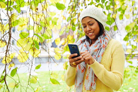Girl in the park on her mobile phone