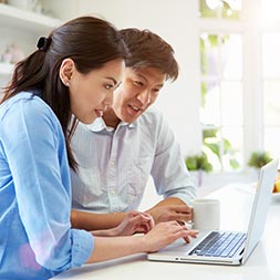 Image of couple researching home loan guides