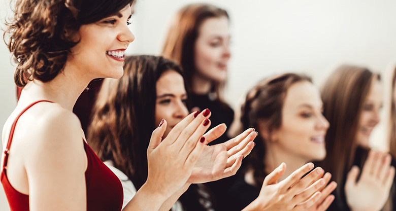 Women clapping hands