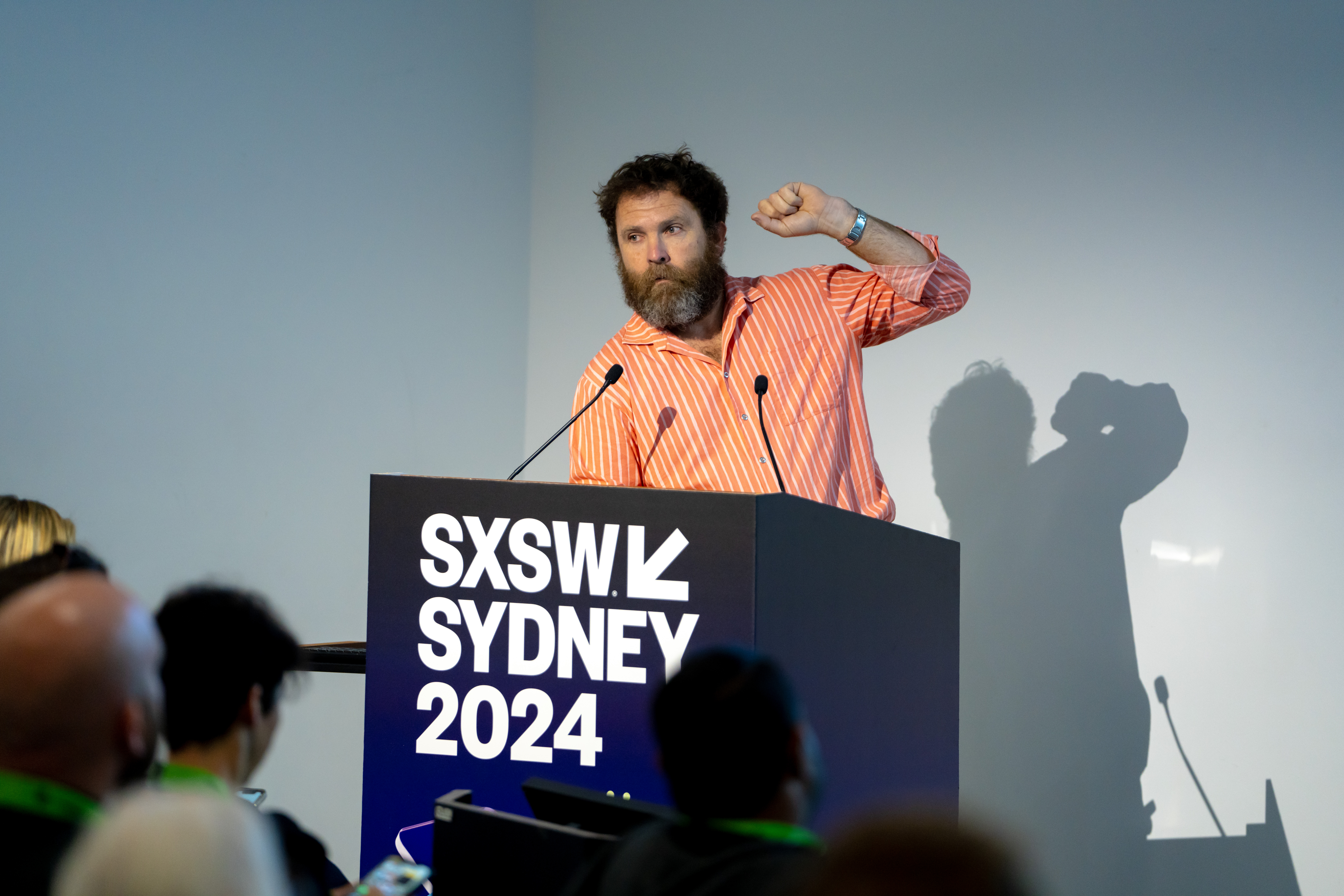 Saul Griffith speaking at a lectern at SXSW Sydney 2024.